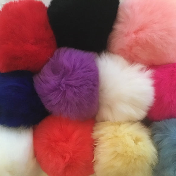 Multi-colour assortment of fur balls from B Unique Millinery