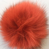 Orange fur Ball from B Unique Millinery
